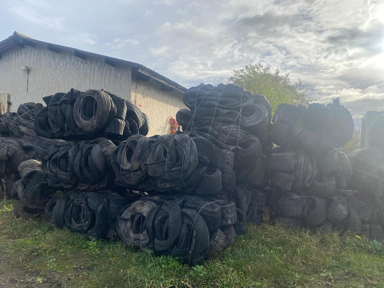 Pressed waste tyre bales with wire binding in a storage yard